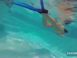 Fabulous brunette slattern Candy swims underwater