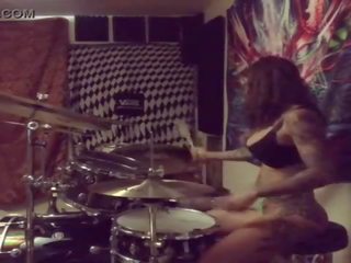 Felicity feline drums in her undies at home