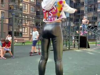 Blonde slut is showing her leather leggings ass in public!